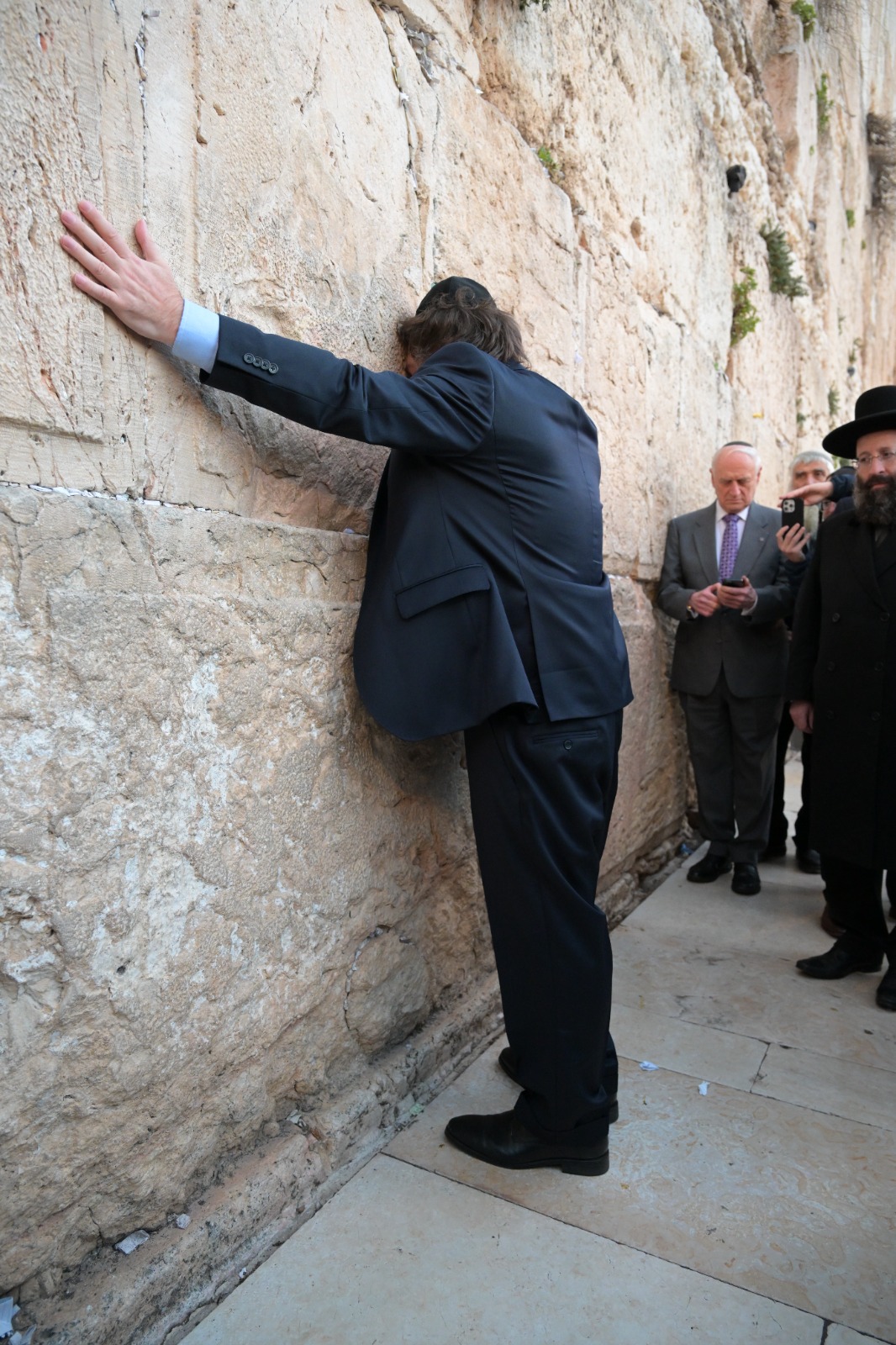 Javier Milei standing at the Western Wall