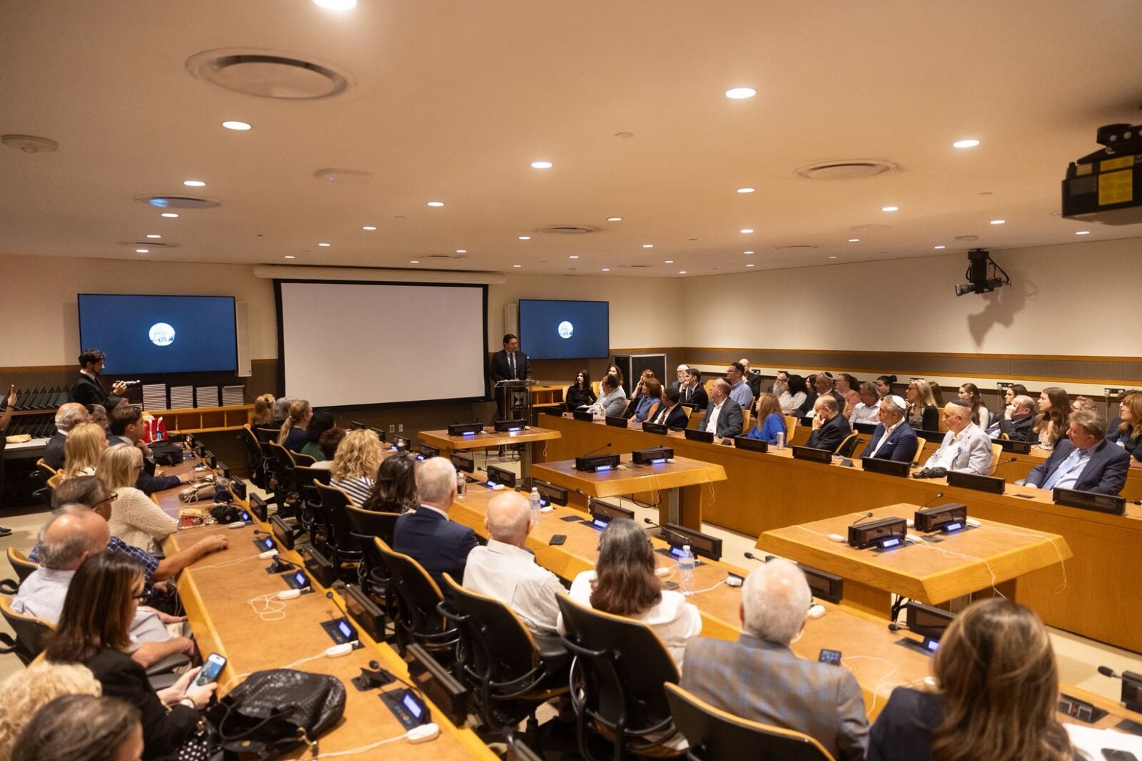 A conference room at UN Headquarters during the launch: Ambassador Danon speaks to an audience seated around the delegates’ desks