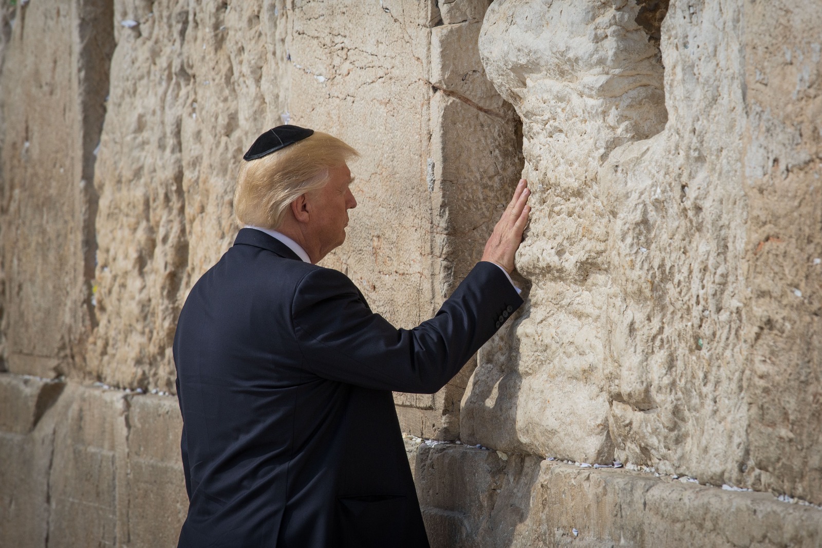 President Donald Trump lays a hand on the stones of the Western Wall, May 2017