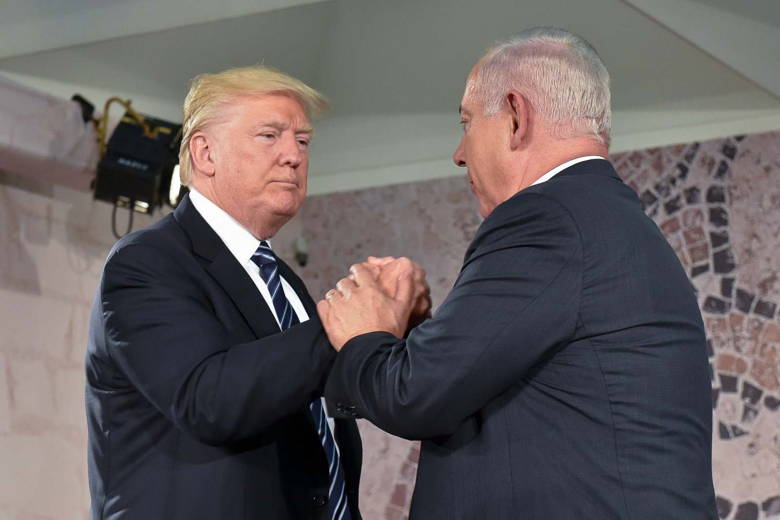 Trump and Prime Minister Benjamin Netanyahu shake hands